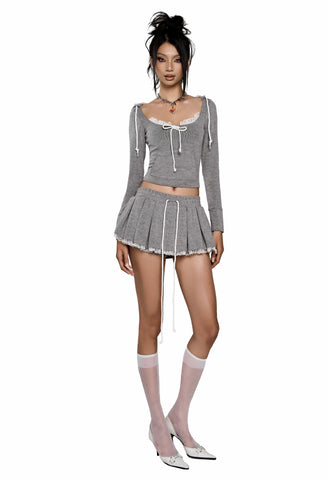 |JENNIE wears| LONG SLEEVE BOWKNOT TOP & PLEATED KNOTTED HEM SKORT LUXE SET